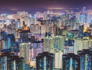 Crowded city at night illustrating how humans have multiplied but not replenished the Earth, leading to mineral and trace mineral deficiency